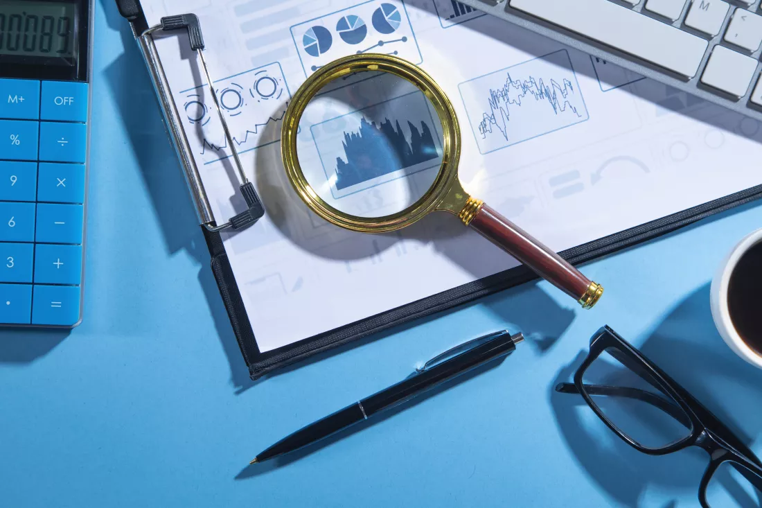 business-graphs-calculator-computer-keyboard-pen-magnifying-glass