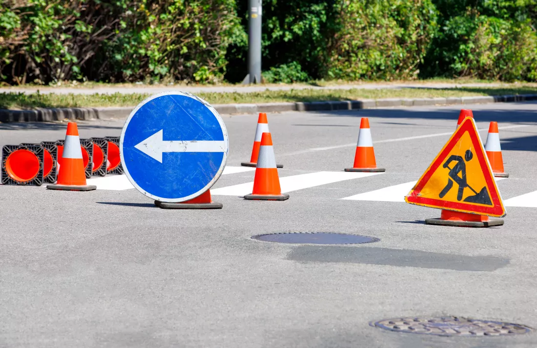 traffic-signs-orange-cones-line-newly-painted-crosswalk