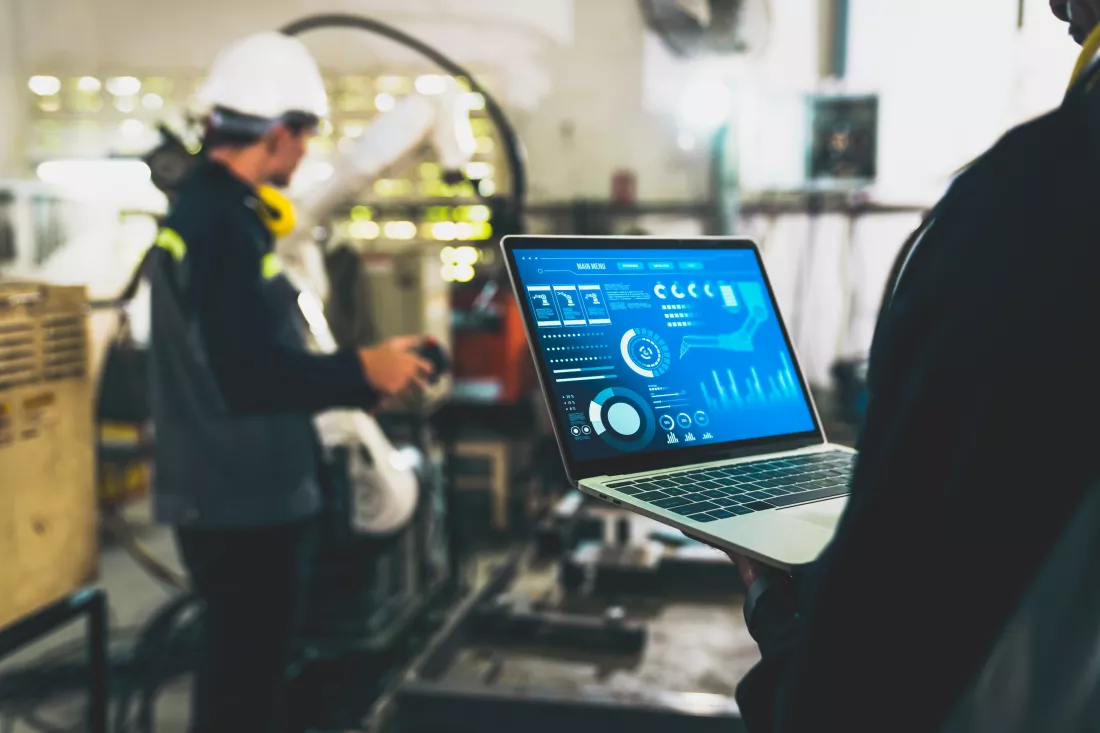 factory-workers-working-with-adept-robotic-arm-workshop