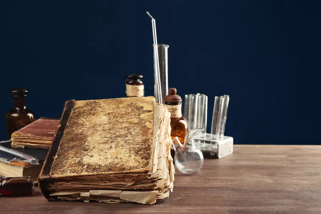 vintage-medicine-bottles-books-wooden-table