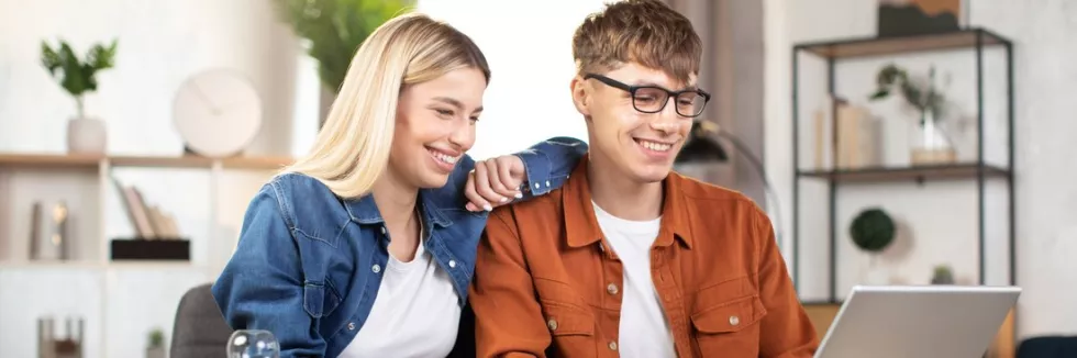 computer-science-and-business-smiling-caucasian-man-and-woman-using-laptop