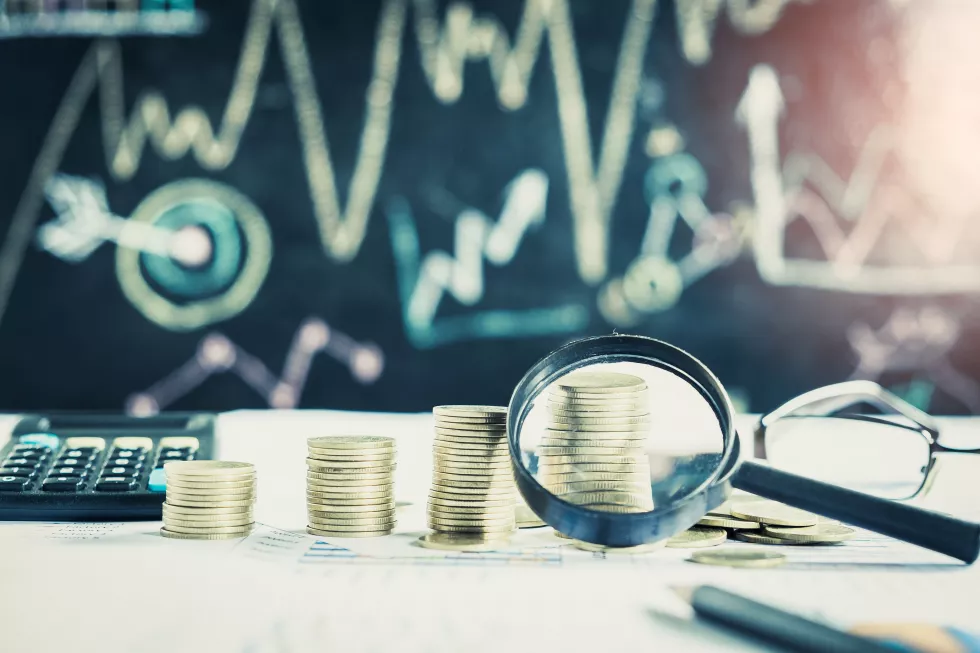 magnifying-glass-pencil-calculator-financial-chart-graph-accounting-background