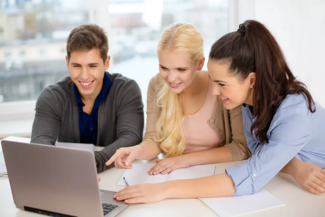 Students working together on a laptop