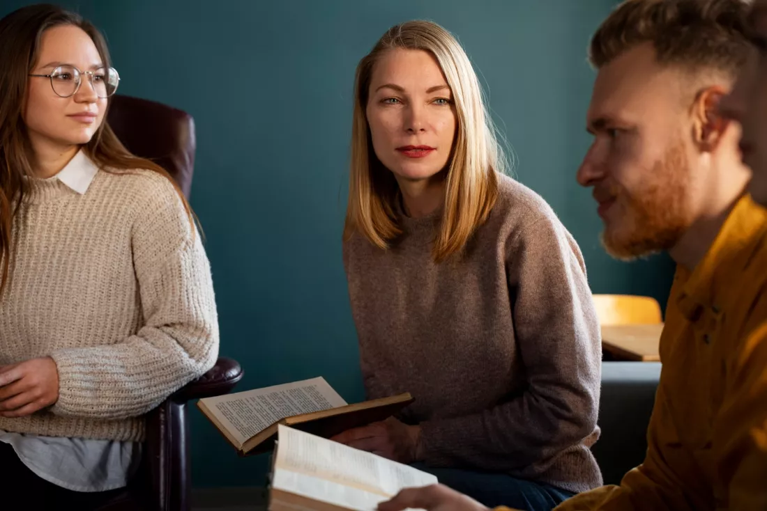 Students discuss a philosophical text during a seminar