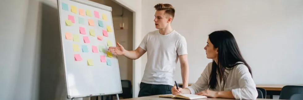 business-students-planning-a-project-with-sticky-notes