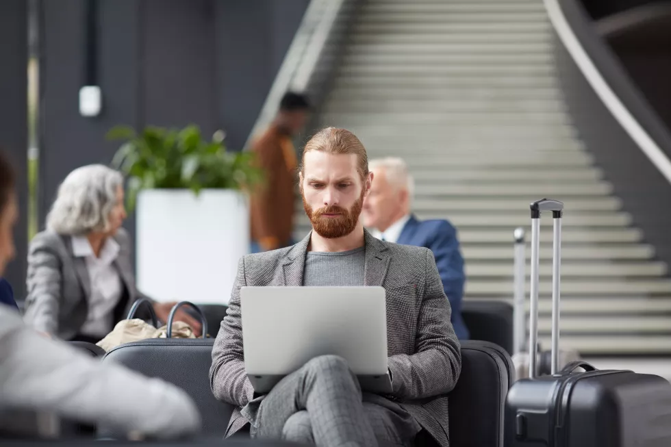 concentrated-guy-working-airport