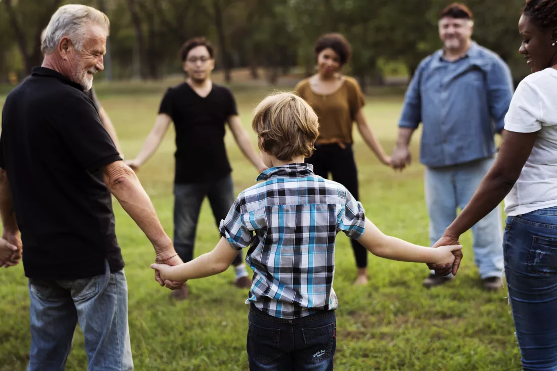 group-people-holding-hand-together-park