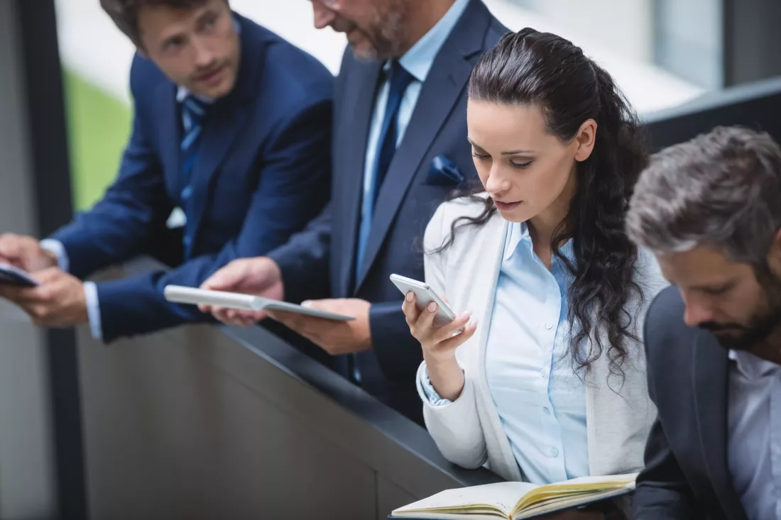businesspeople-using-mobile-phone-digital-tablet