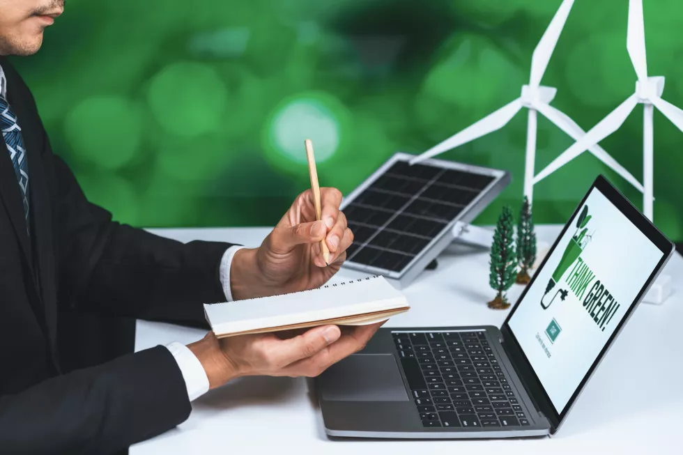 businessman-working-office-developing-plan-alternative-energy-gyre