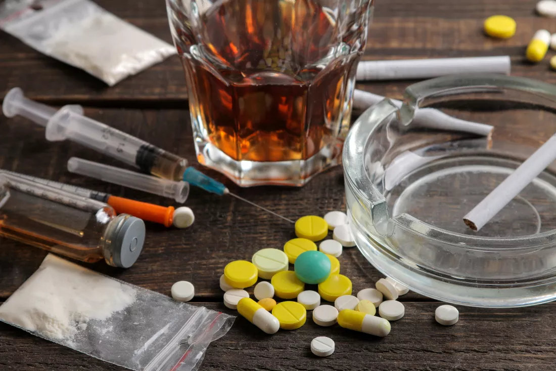 various-addictive-drugs-including-alcohol-cigarettes-drugs-brown-wooden-table-drug-addiction-concept