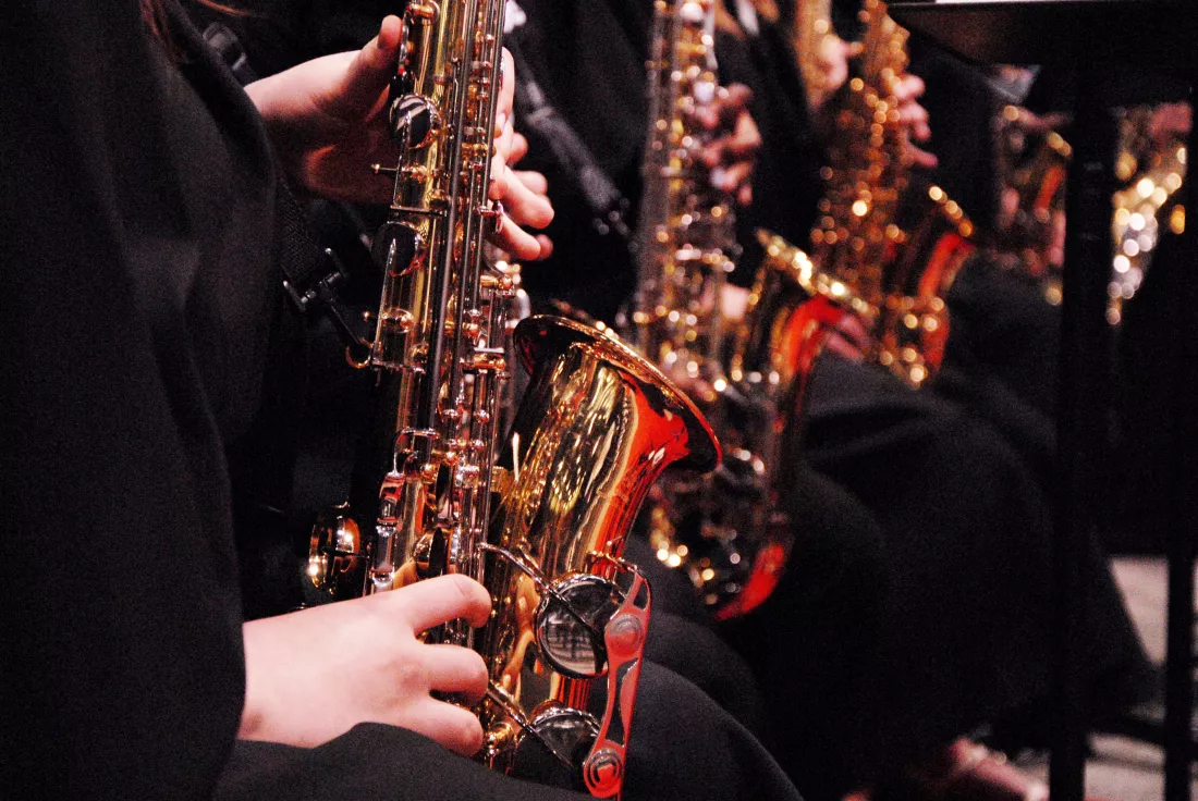 cropped-image-musician-playing-saxophones